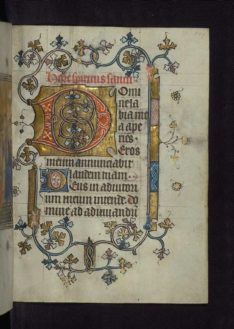 Verluchte pagina uit een getijdenboek met rijk bladwerk en versierde initiaal.
